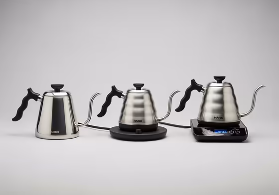 A lineup of the three main Hario V60 Buono kettles: stovetop, basic electric, and variable temperature electric.